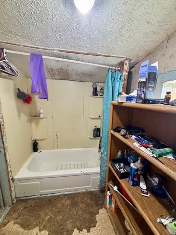 Bathroom 1 tub and shower.