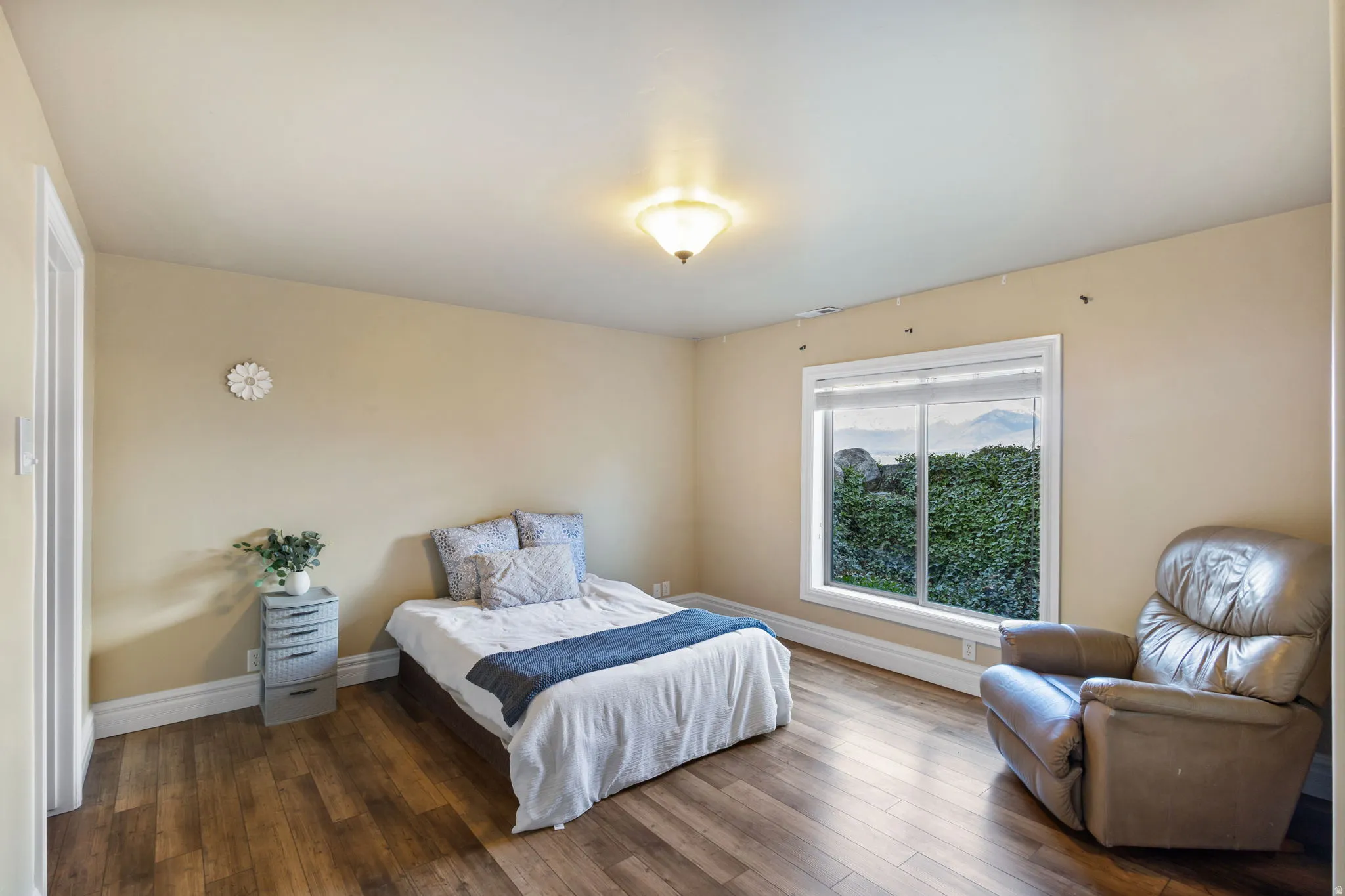 Bedroom with baseboards and dark wood finished floors