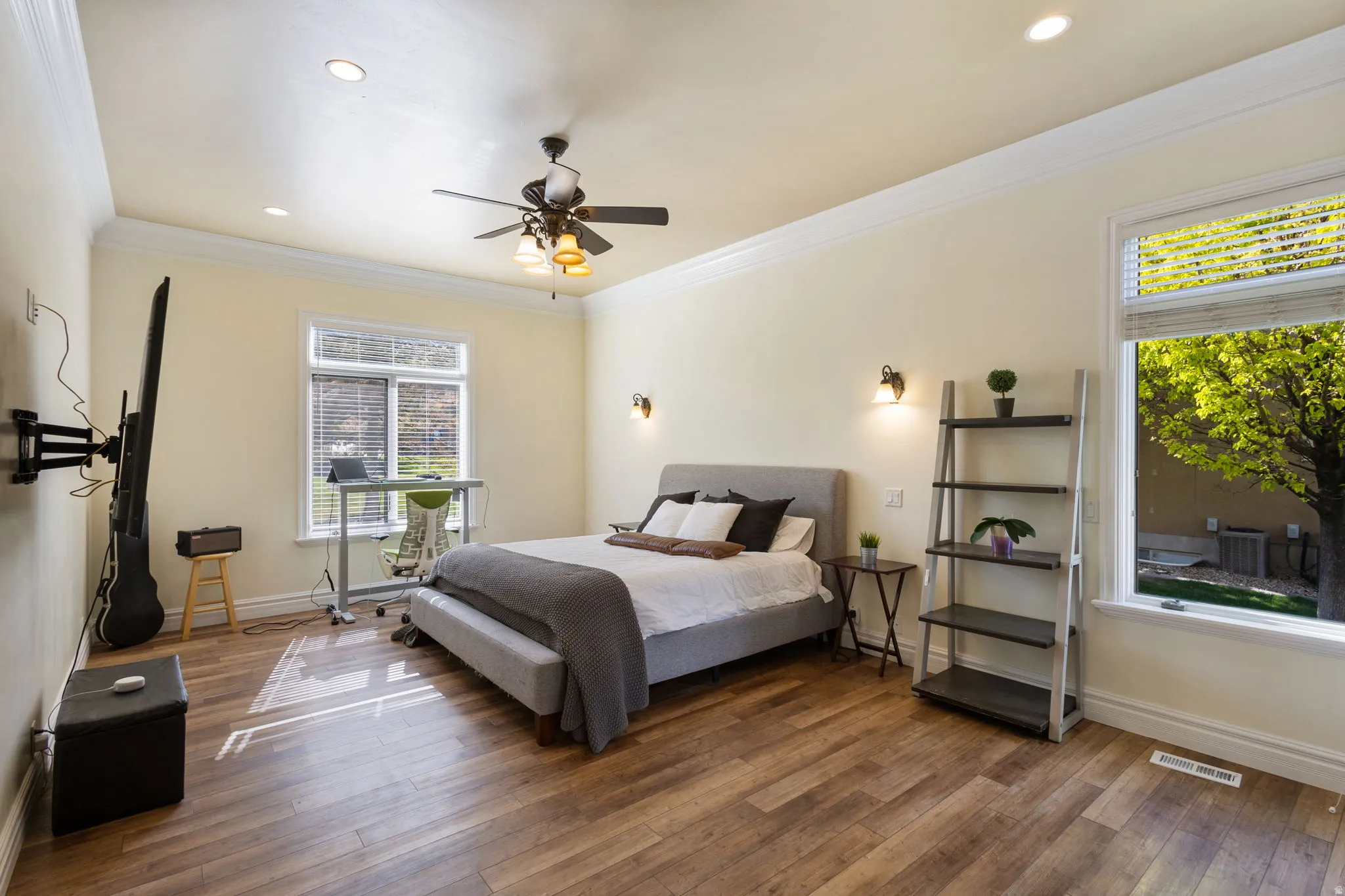 Bedroom with crown molding, dark wood finished floors, ceiling fan, and recessed lighting