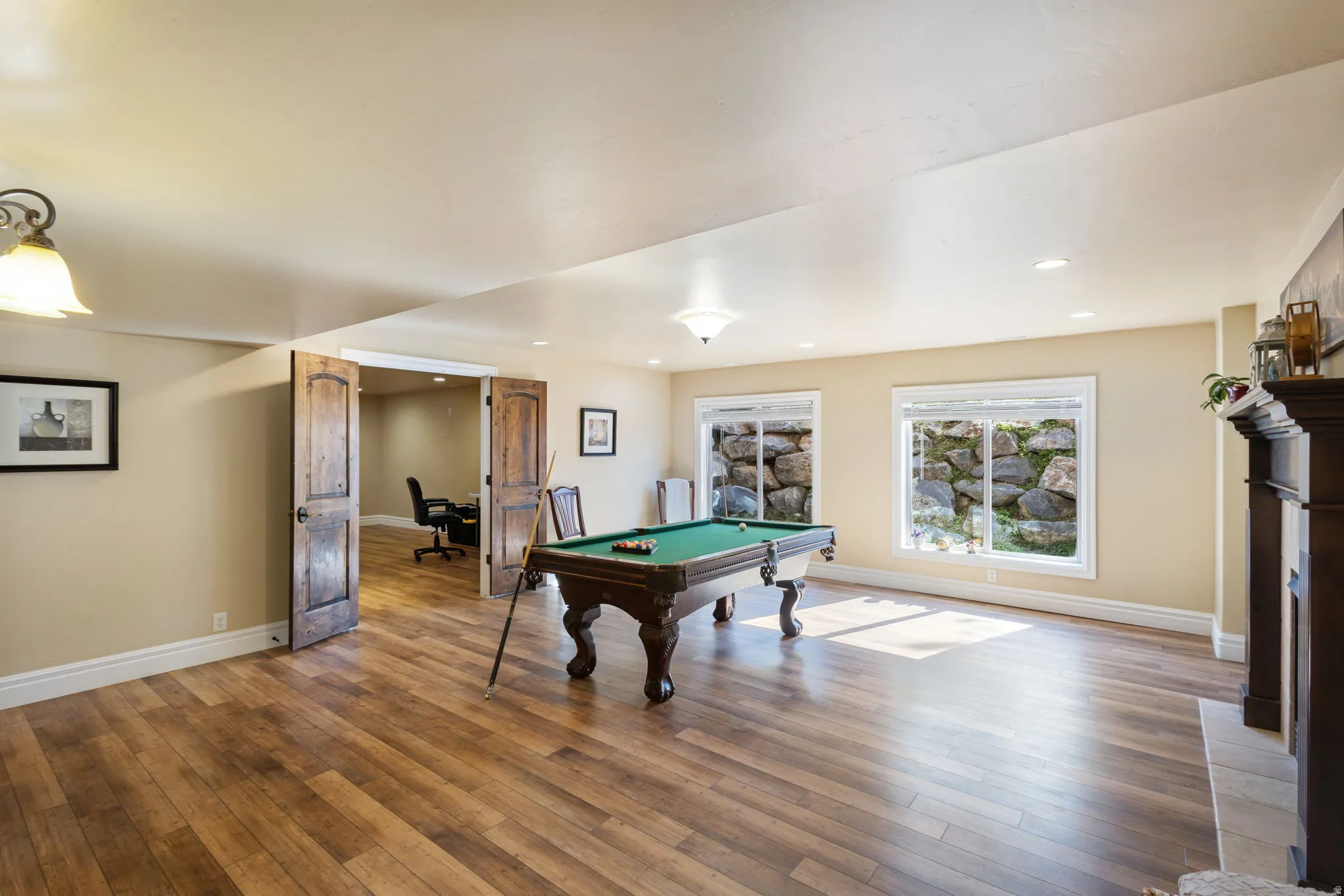 Playroom with billiards table, hardwood / wood-style flooring, recessed lighting, a fireplace, and a desk