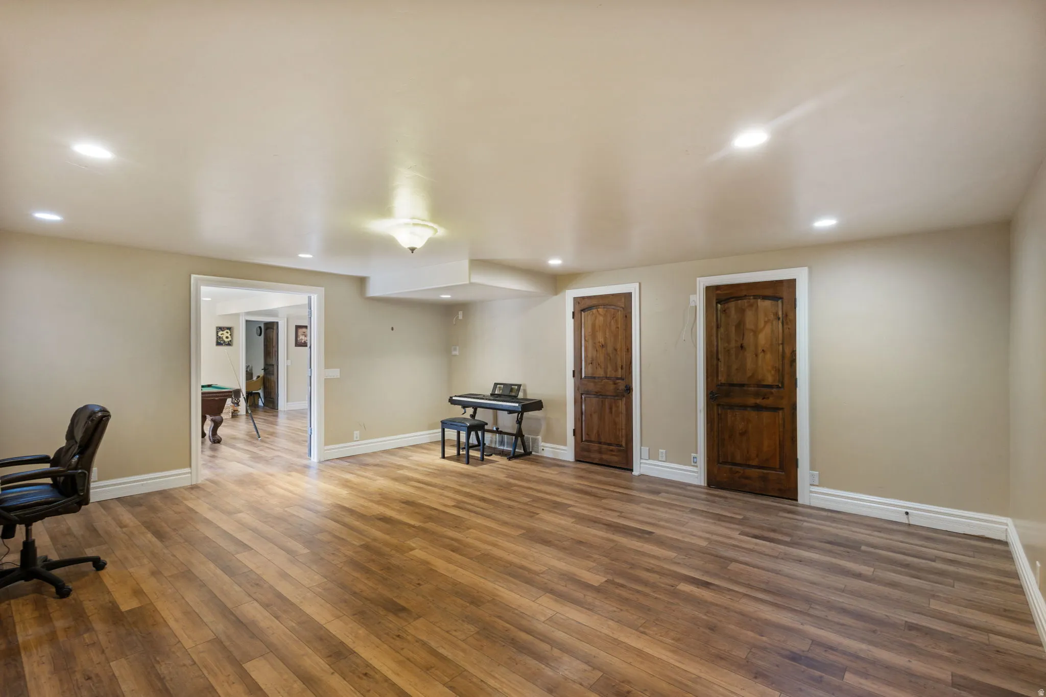 Unfurnished office with wood-type flooring and recessed lighting