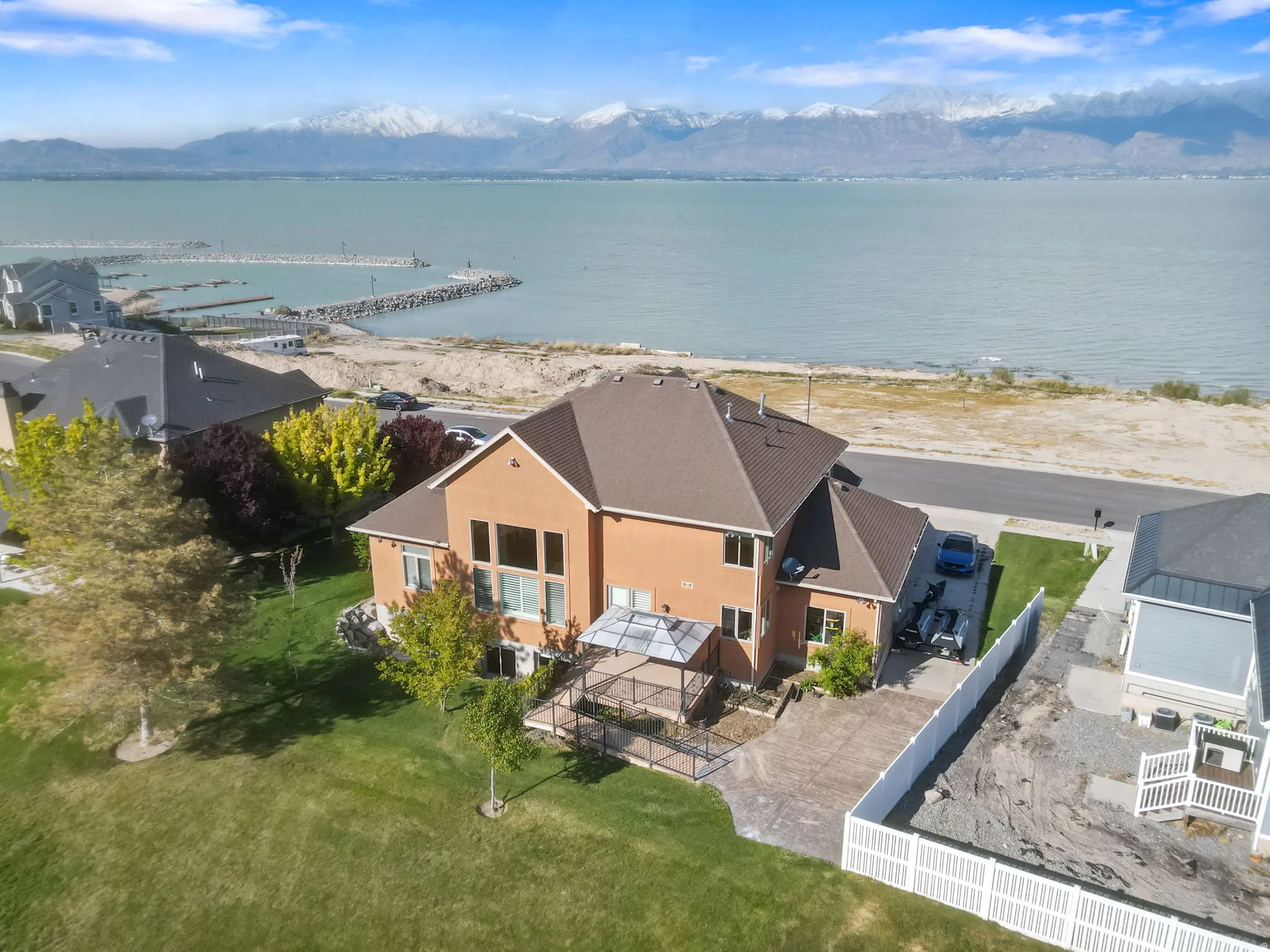 Aerial view of property and surrounding area featuring a water and mountain view
