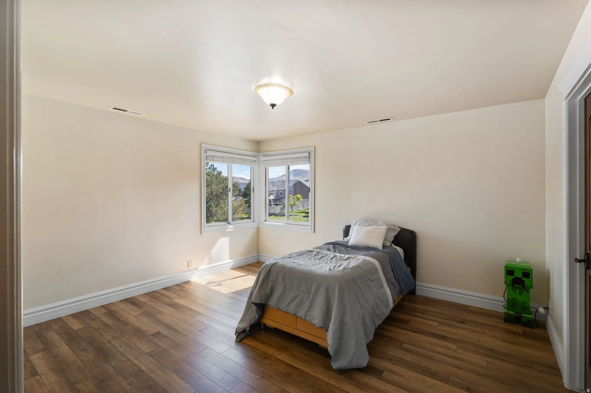 Bedroom featuring dark wood-type flooring