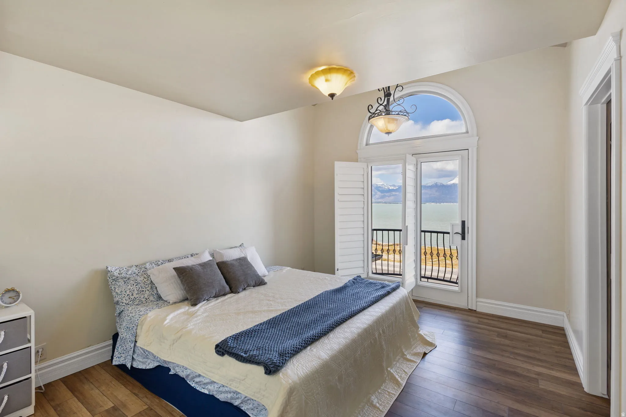 Bedroom with dark wood-type flooring and access to outside