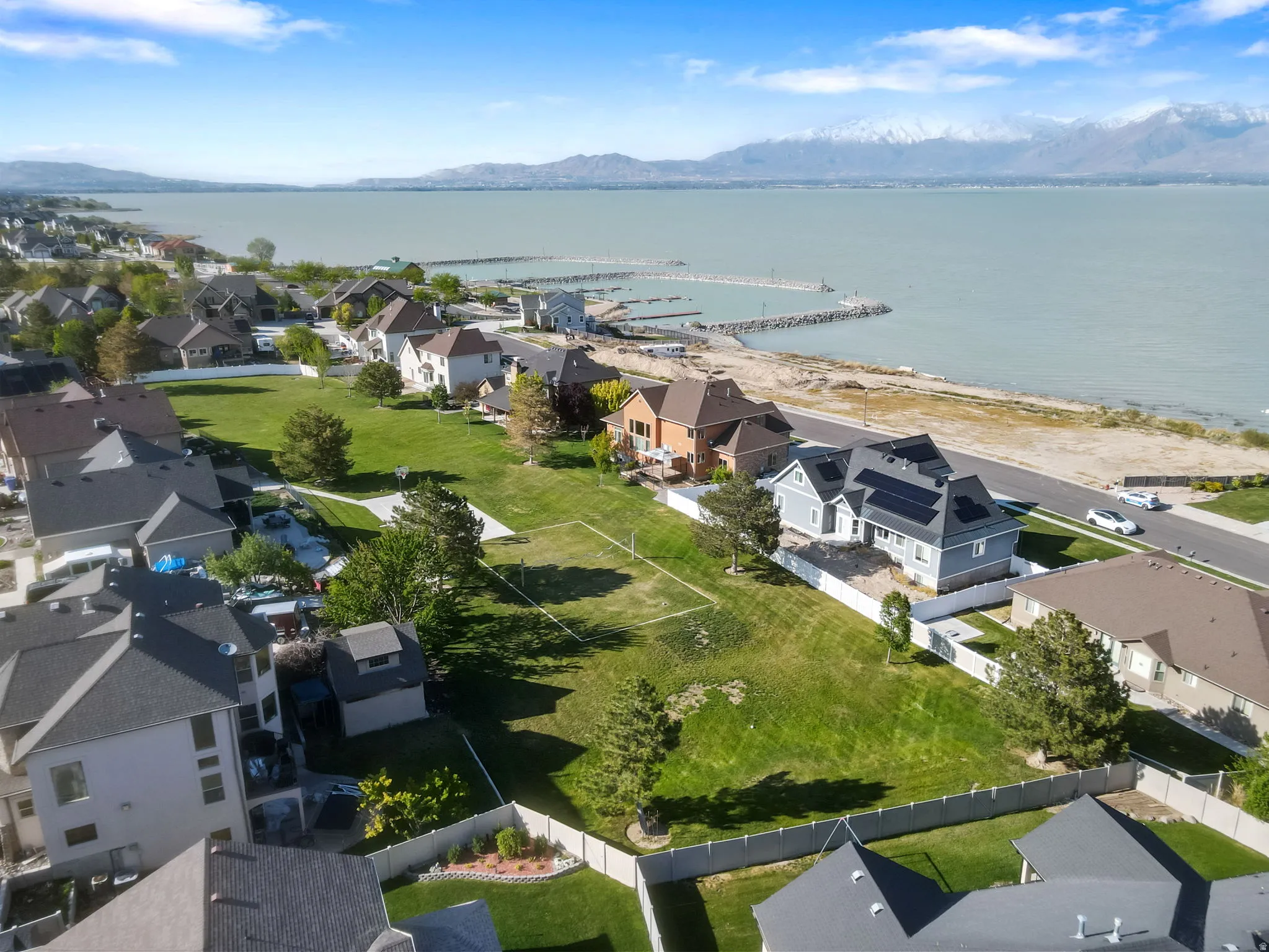 Aerial perspective of suburban area featuring a water and mountain view