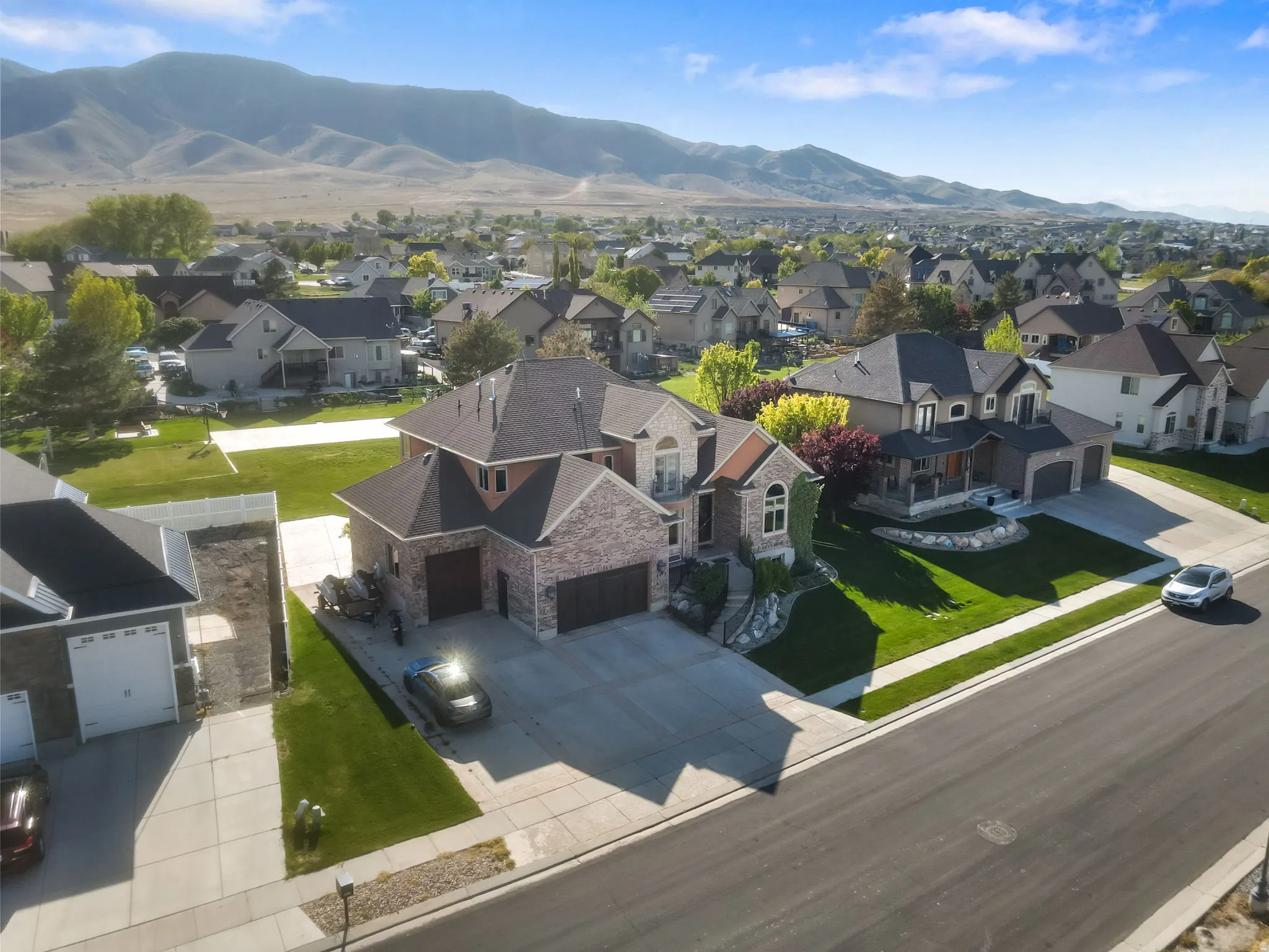 Aerial view of residential area featuring mountains