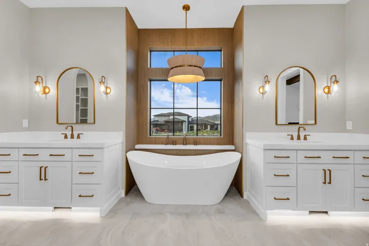 Freestanding soaking tub with a wood-finish accent wall