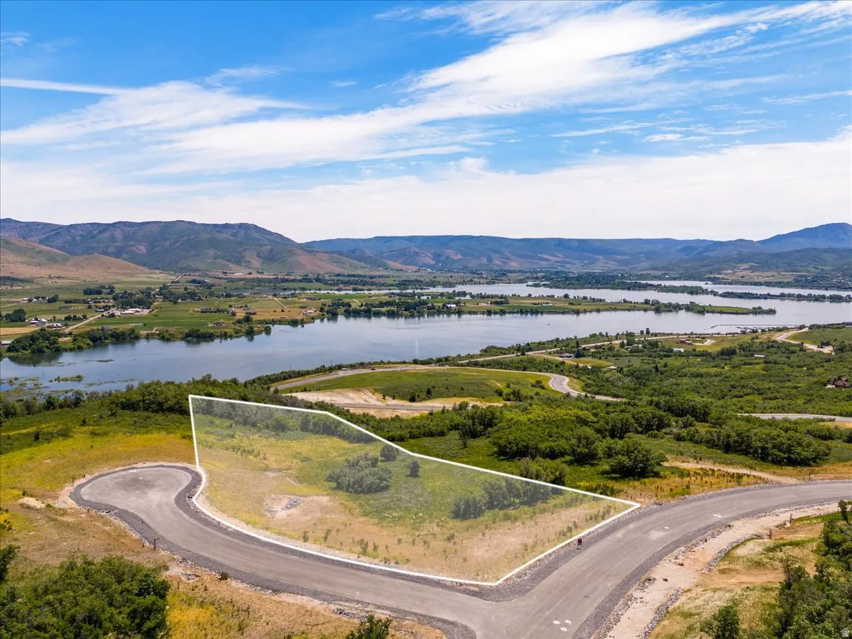 View of property location featuring property parcel outlined and a water and mountain view
