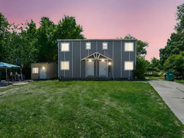 Contemporary duplex exterior with a gray facade and white trim
