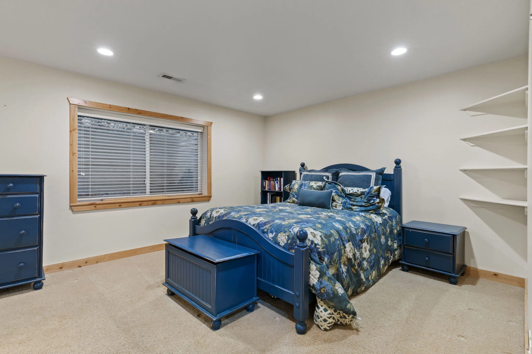 Basement bedroom with neutral wall tones define this space