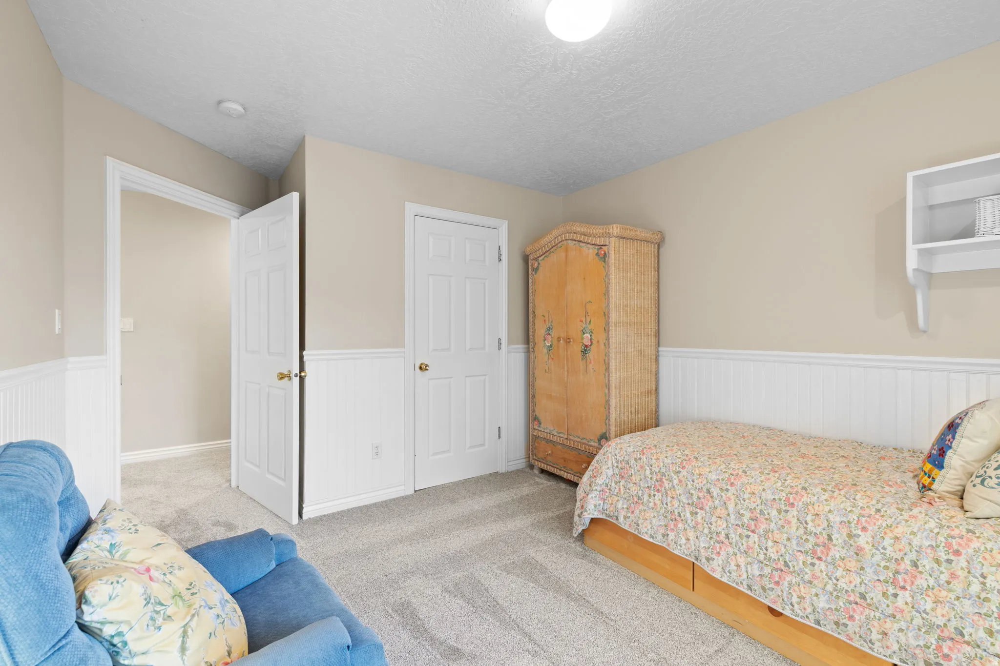 Neutral tone wall paint with white wainscoting and trim