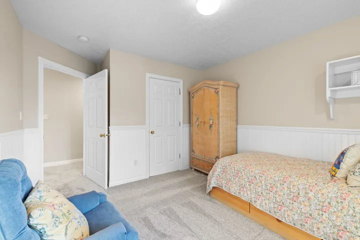 Neutral tone wall paint with white wainscoting and trim
