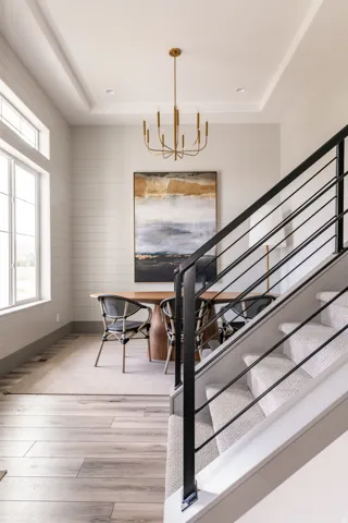 Open foyer featuring wide plank wood-finish flooring