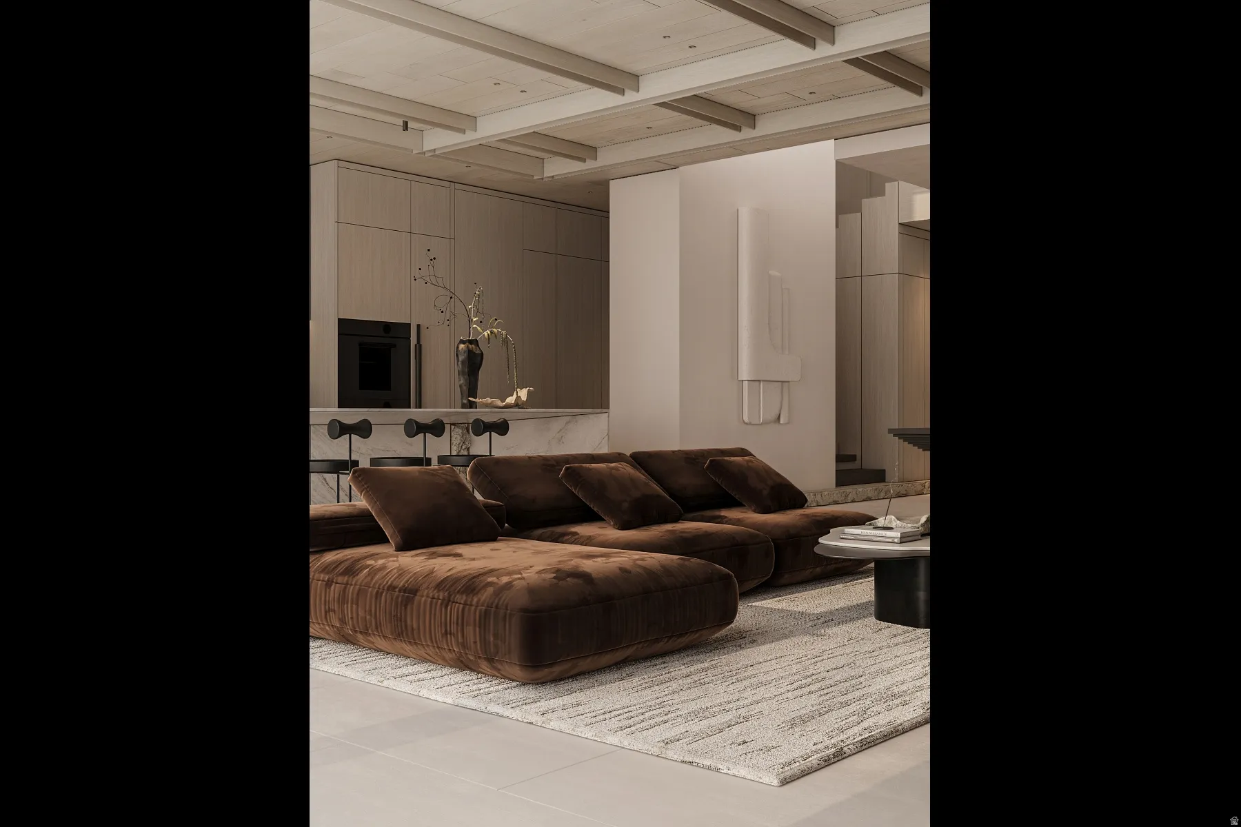 Open-concept living area featuring a light-toned ceiling with exposed beams, large format floor tiling, and a neutral area rug