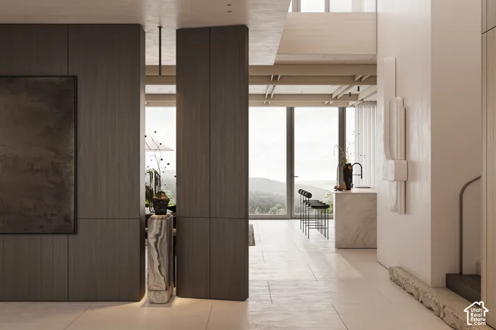 Spacious interior featuring large format floor tiling and floor-to-ceiling windows