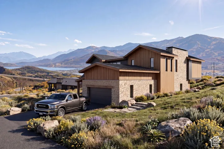 Contemporary home featuring natural wood siding and stone masonry accents