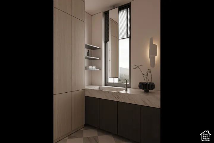 Bathroom vanity with an integrated basin, featuring a natural stone countertop and dark wood-finish cabinetry