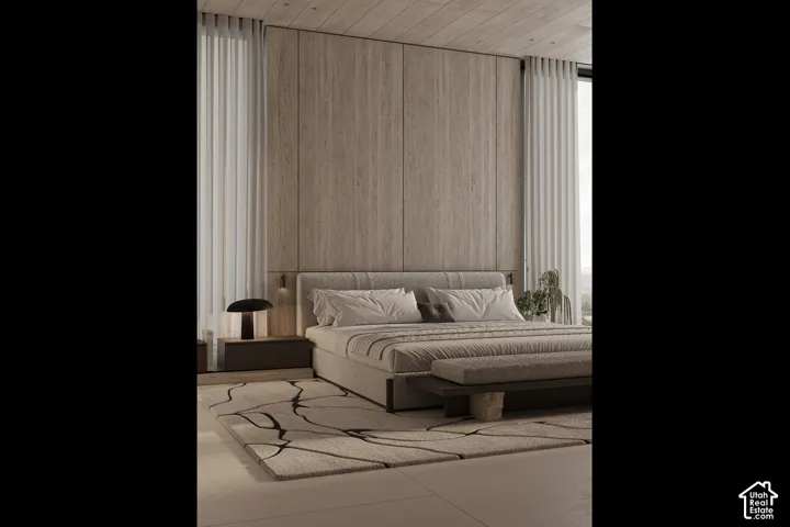 Spacious bedroom featuring light-toned wood paneling, a wood-finish ceiling, and large windows with sheer drapes