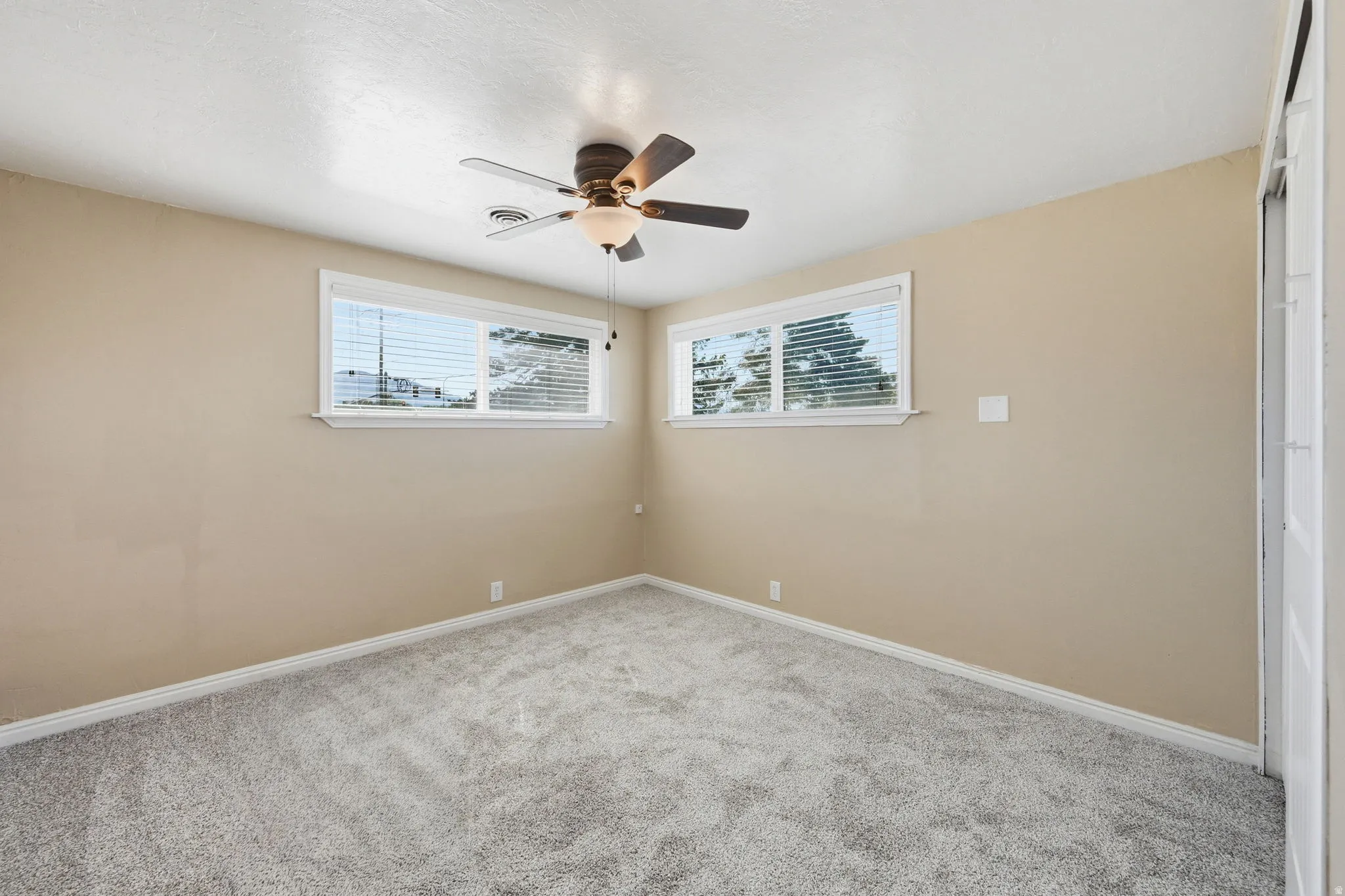 Neutral tone wall paint with crisp white trim