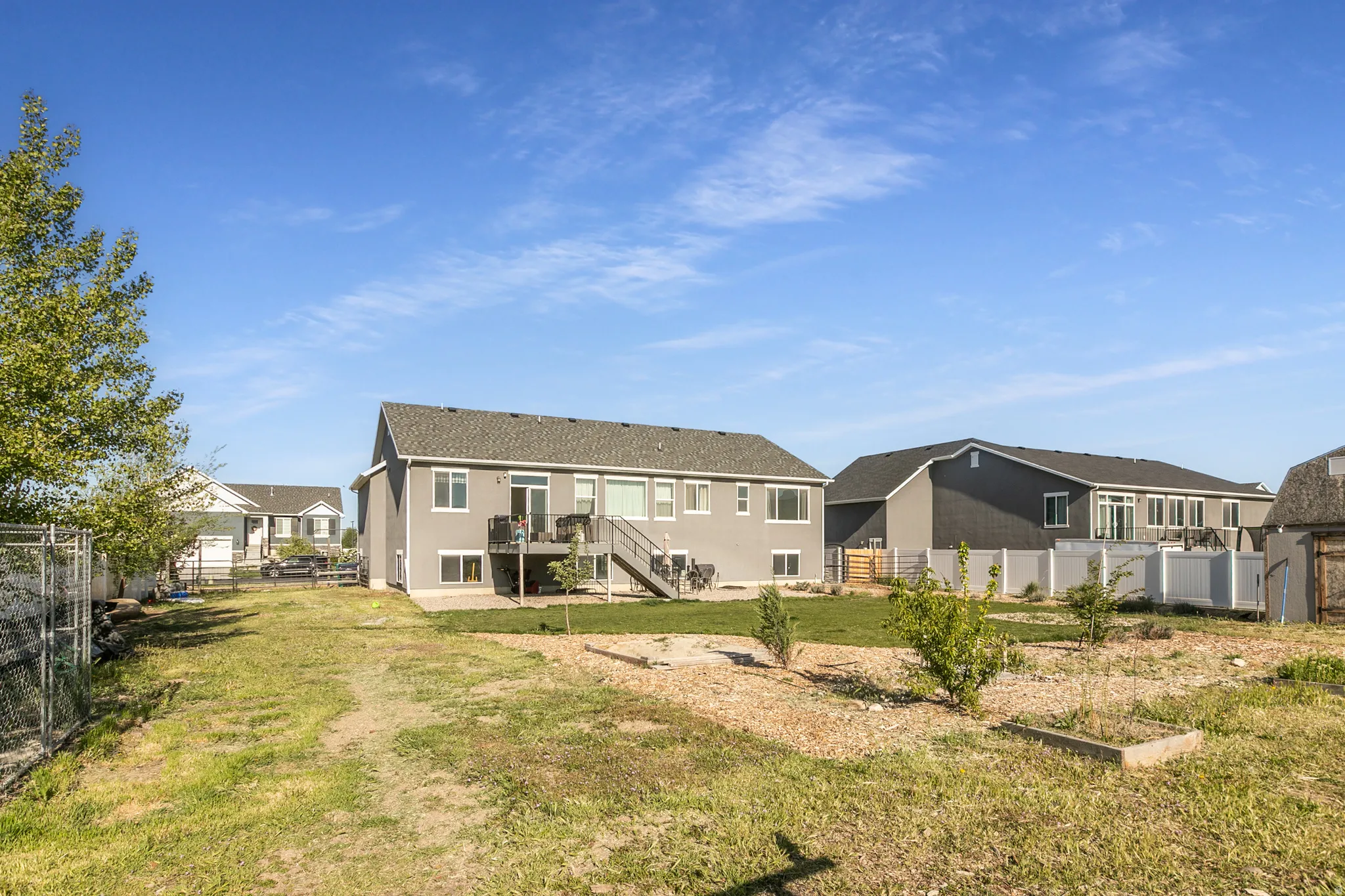 Two-story residence with gray siding and white trim