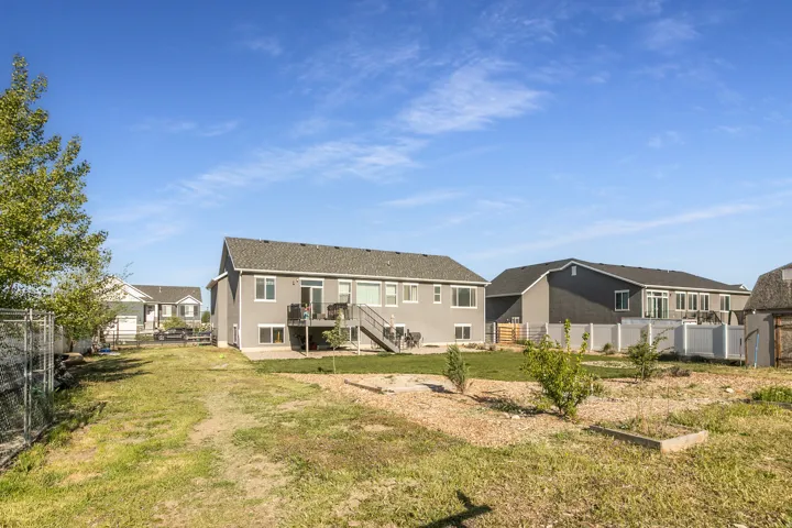 Two-story residence with gray siding and white trim