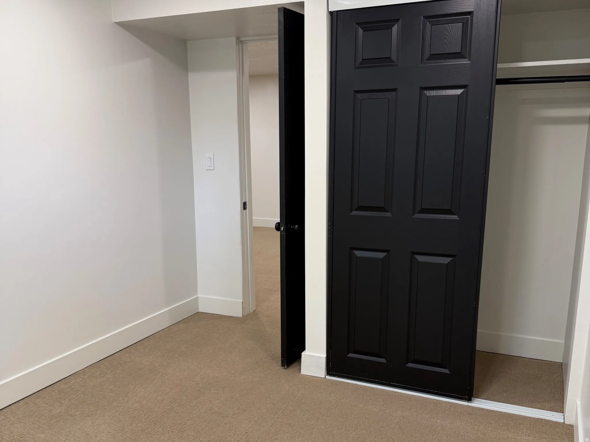 Unfurnished bedroom featuring light colored carpet, a closet, and recessed lighting