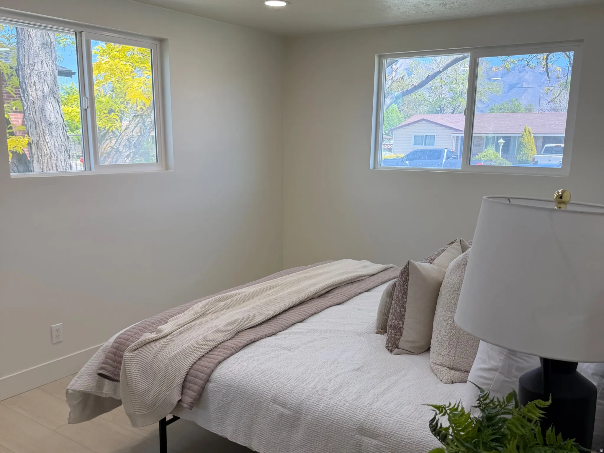 Bedroom featuring recessed lighting, a textured ceiling, and light wood finished floors