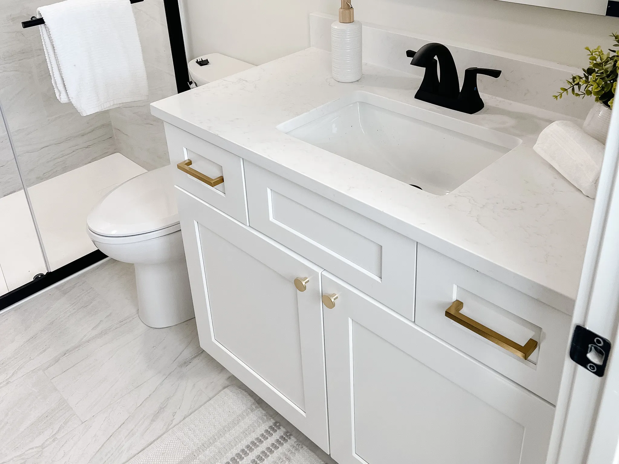 Bathroom with vanity and a stall shower