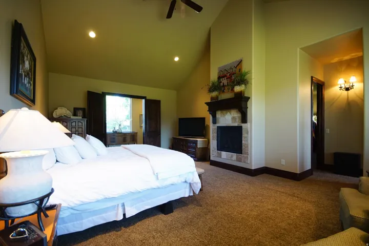 Vaulted ceiling featuring recessed lighting and a ceiling fan
