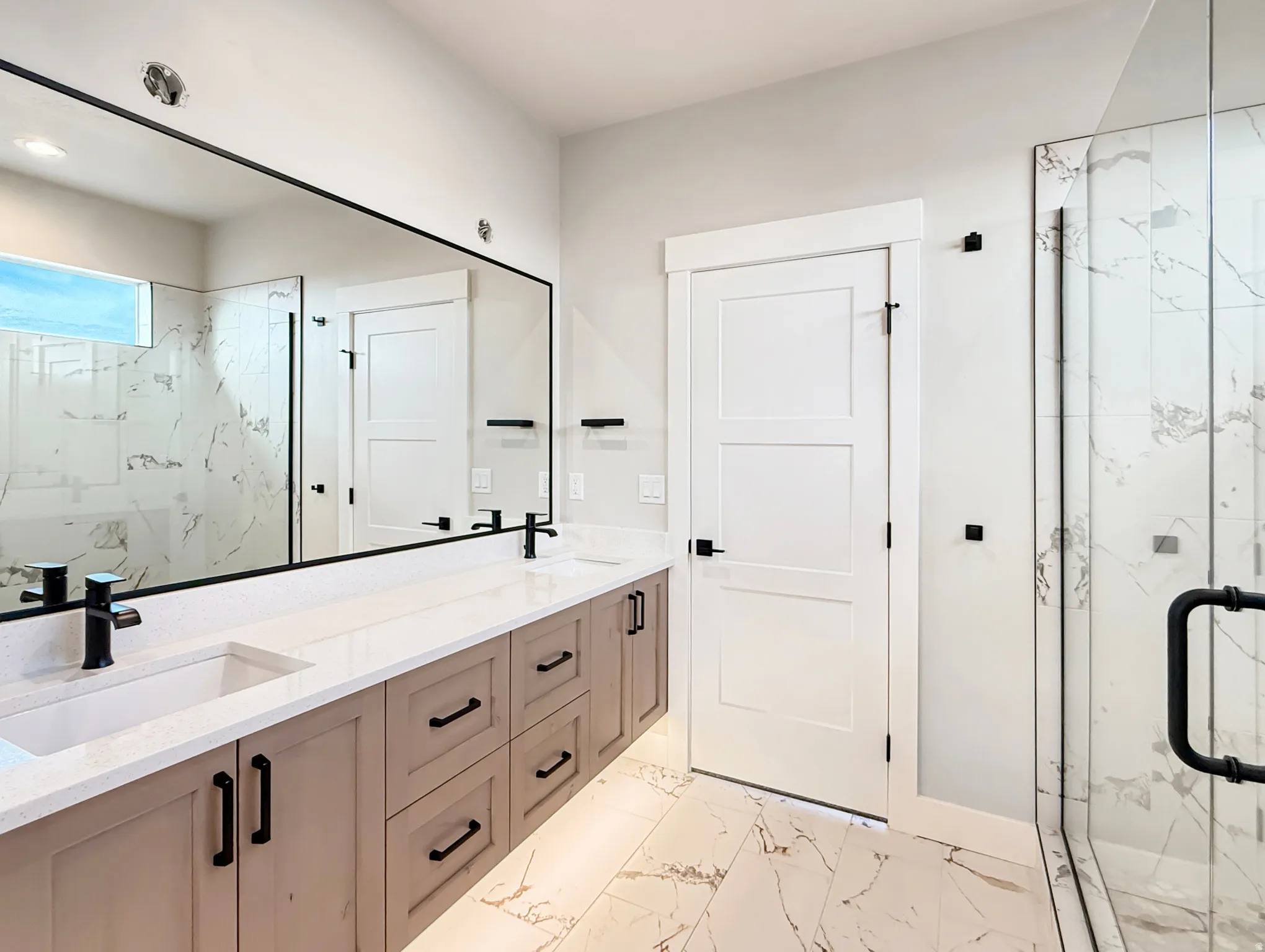 Dual vanity with integrated sinks, quartz countertops, and matte black fixtures