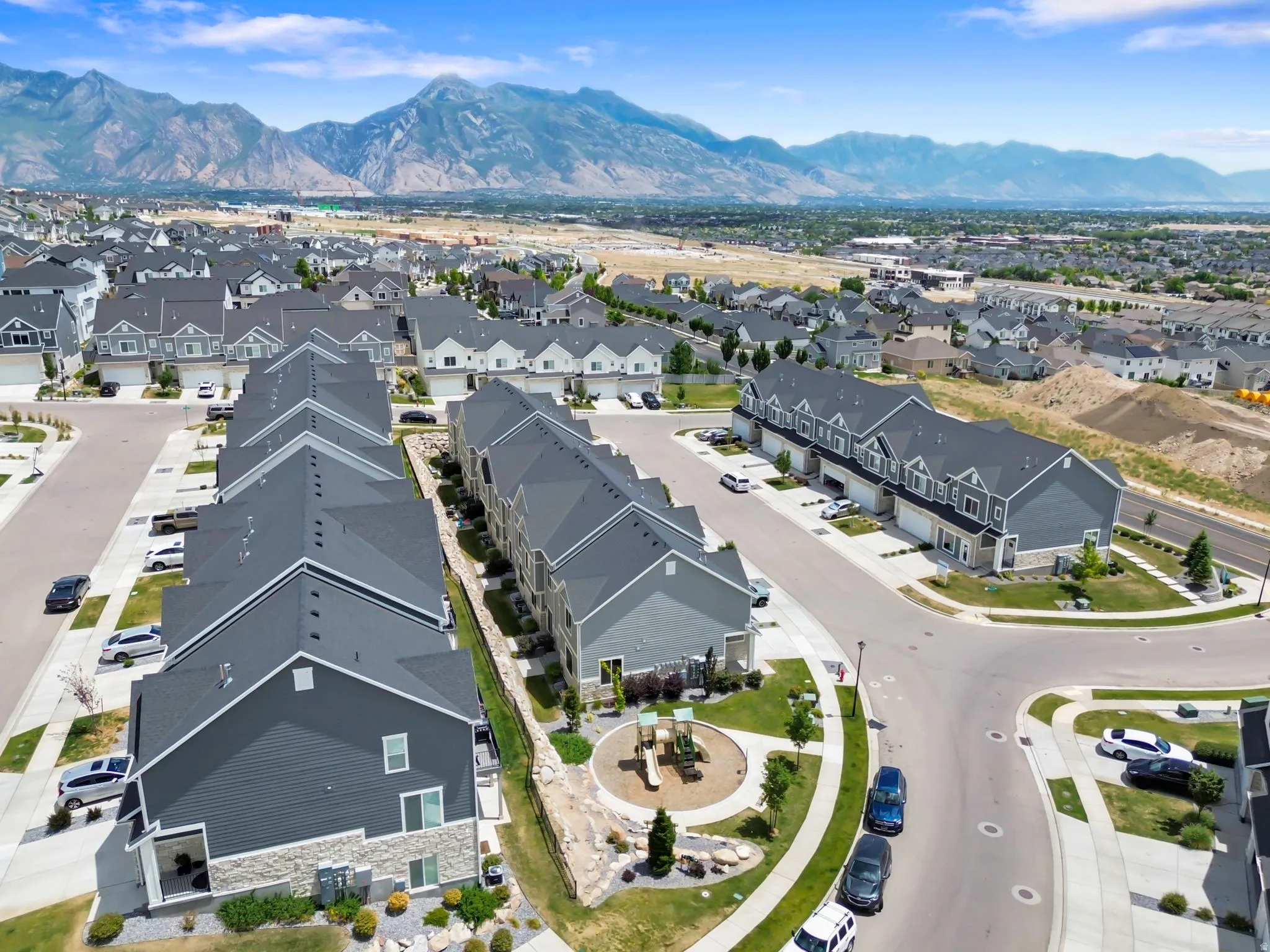 Townhome community featuring contemporary architecture with stone and siding exteriors
