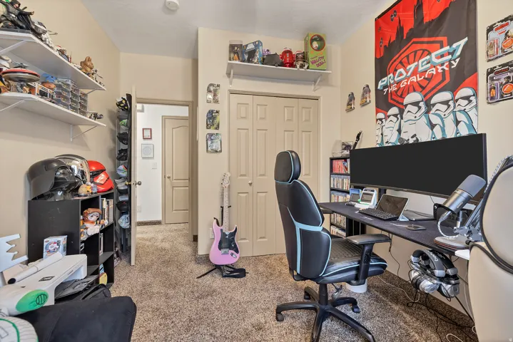 Office area featuring light carpet