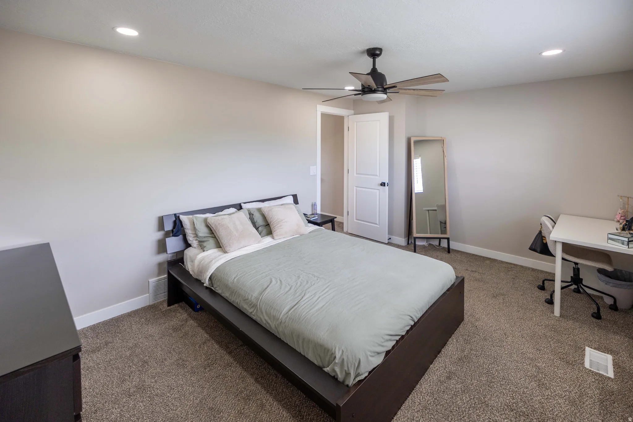 Master Bedroom with recessed lighting and ceiling fan