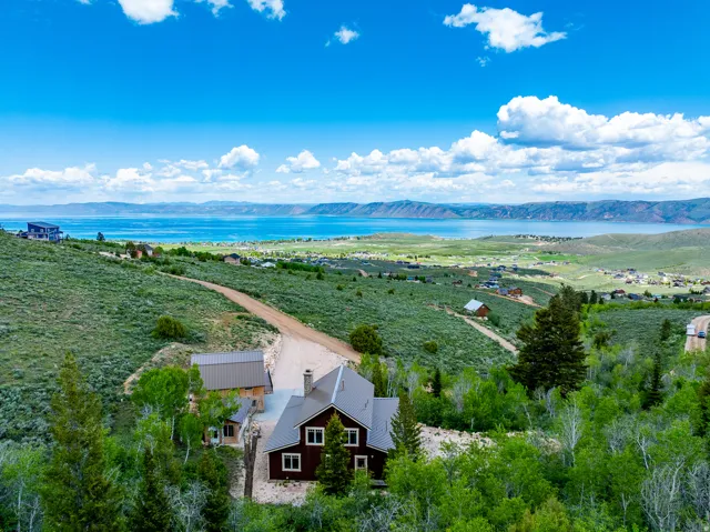 View from above of property featuring a water and mountain view
