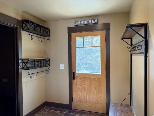 Doorway featuring tile floors