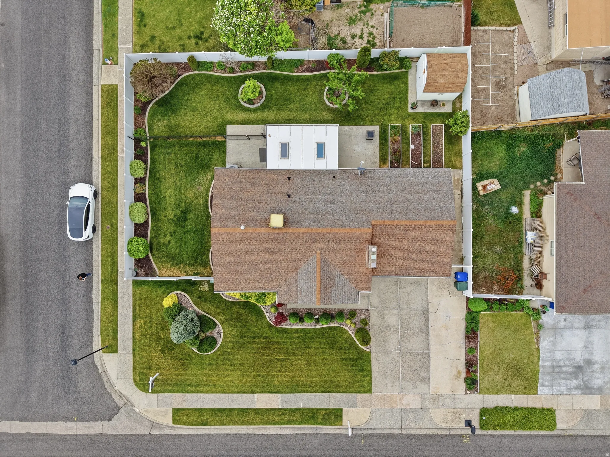 Property with a shingle roof and a concrete driveway