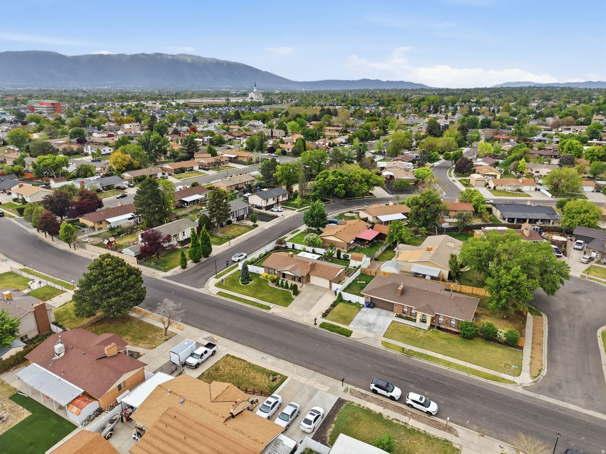 Aerial perspective showcasing a residential neighborhood with varied architectural styles and mature landscaping