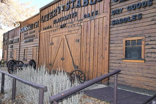 Rustic wood-paneled exterior featuring a prominent double-door entry