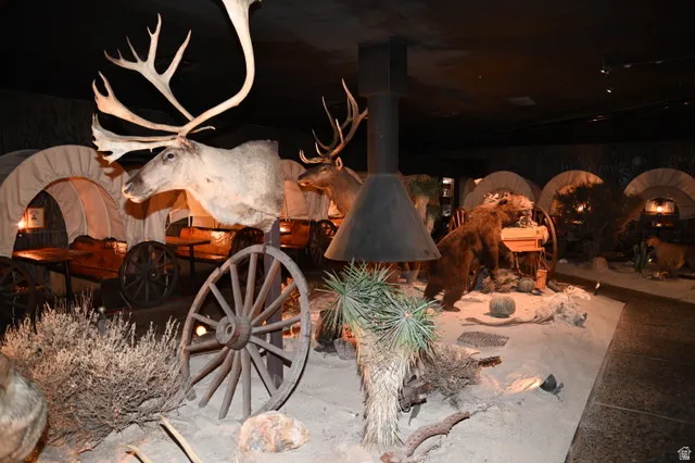 Themed interior space featuring multiple covered wagon booths with integrated seating and tables