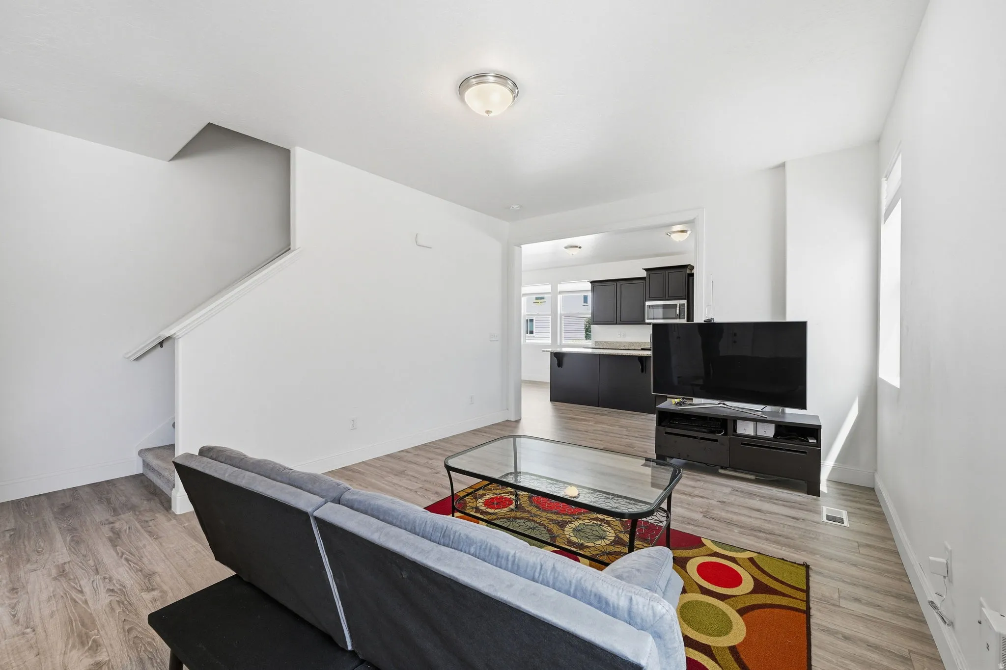 Living area with light wood-style floors