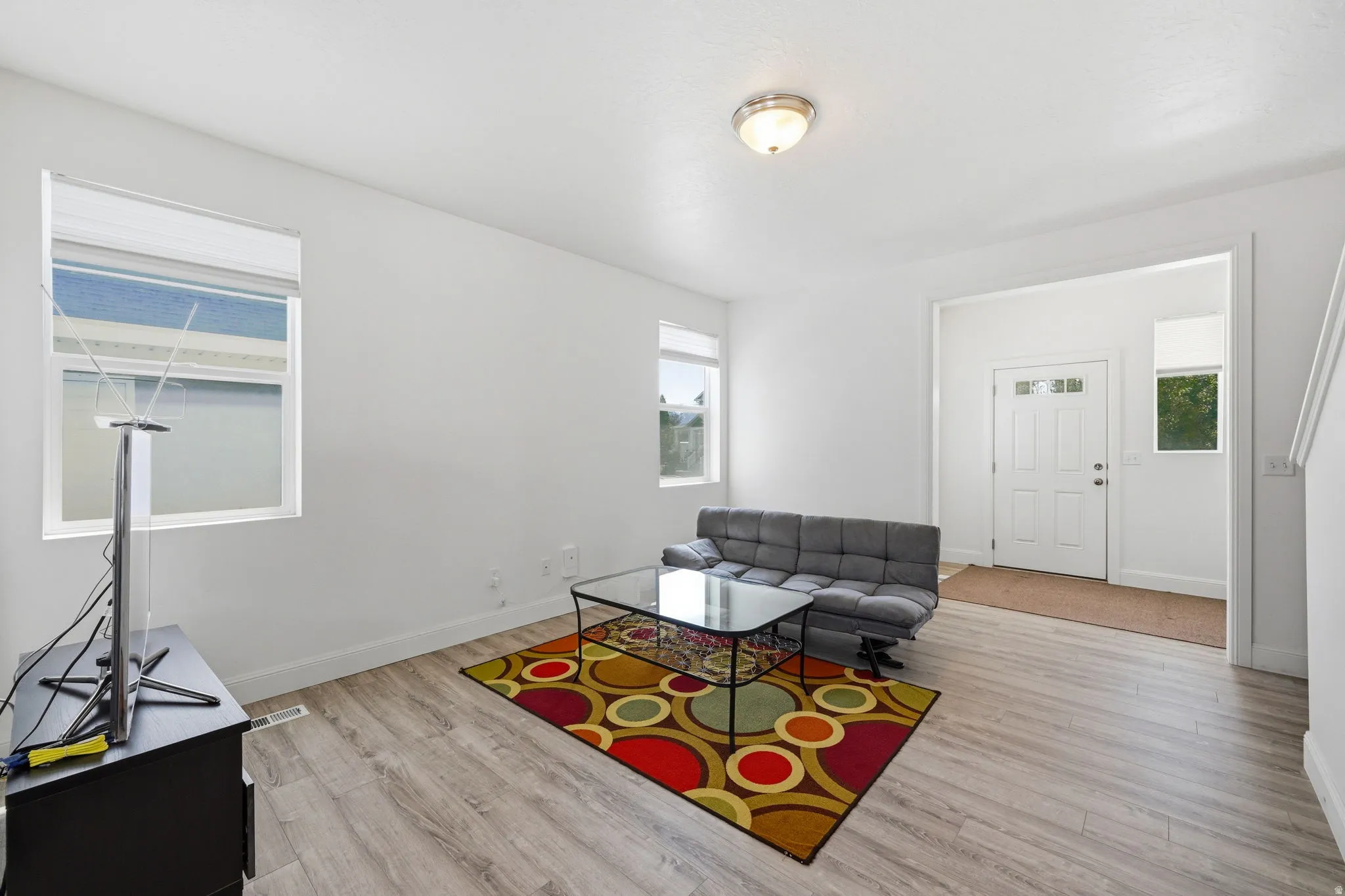 Living area featuring light wood-style flooring