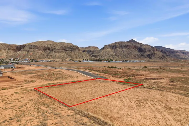 Expansive undeveloped land parcel outlined in red, featuring a flat topography