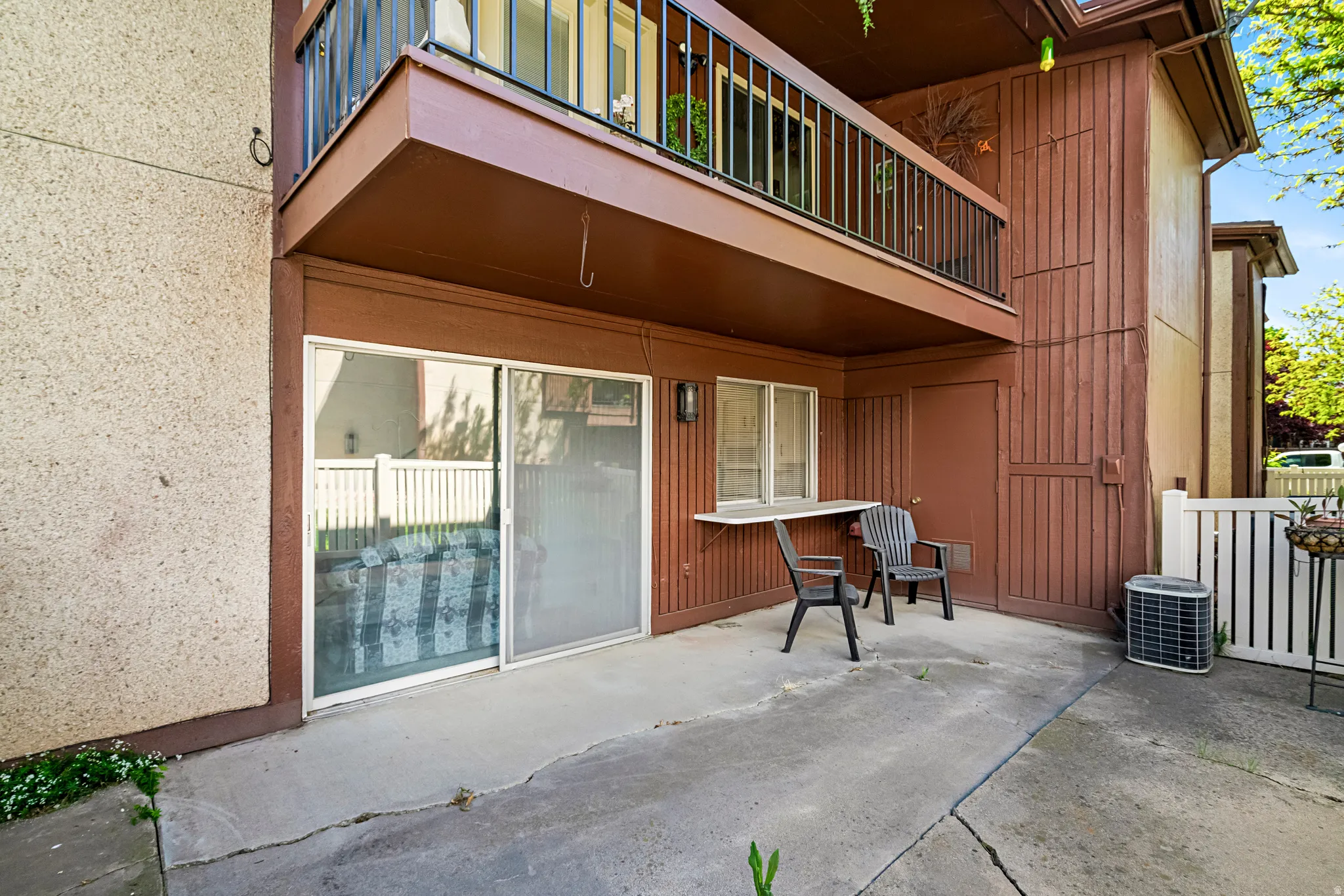 Ground-level patio with concrete flooring