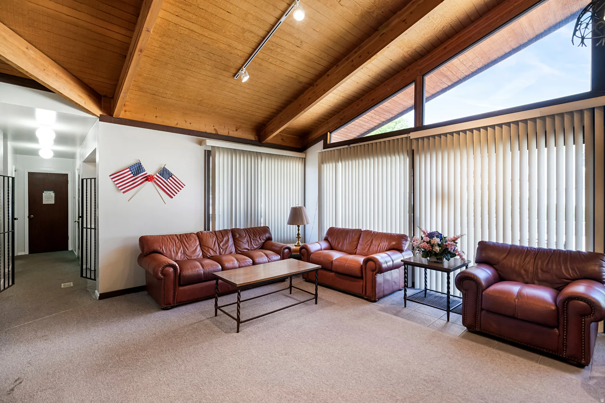 Vaulted wood-paneled ceiling with exposed beams
