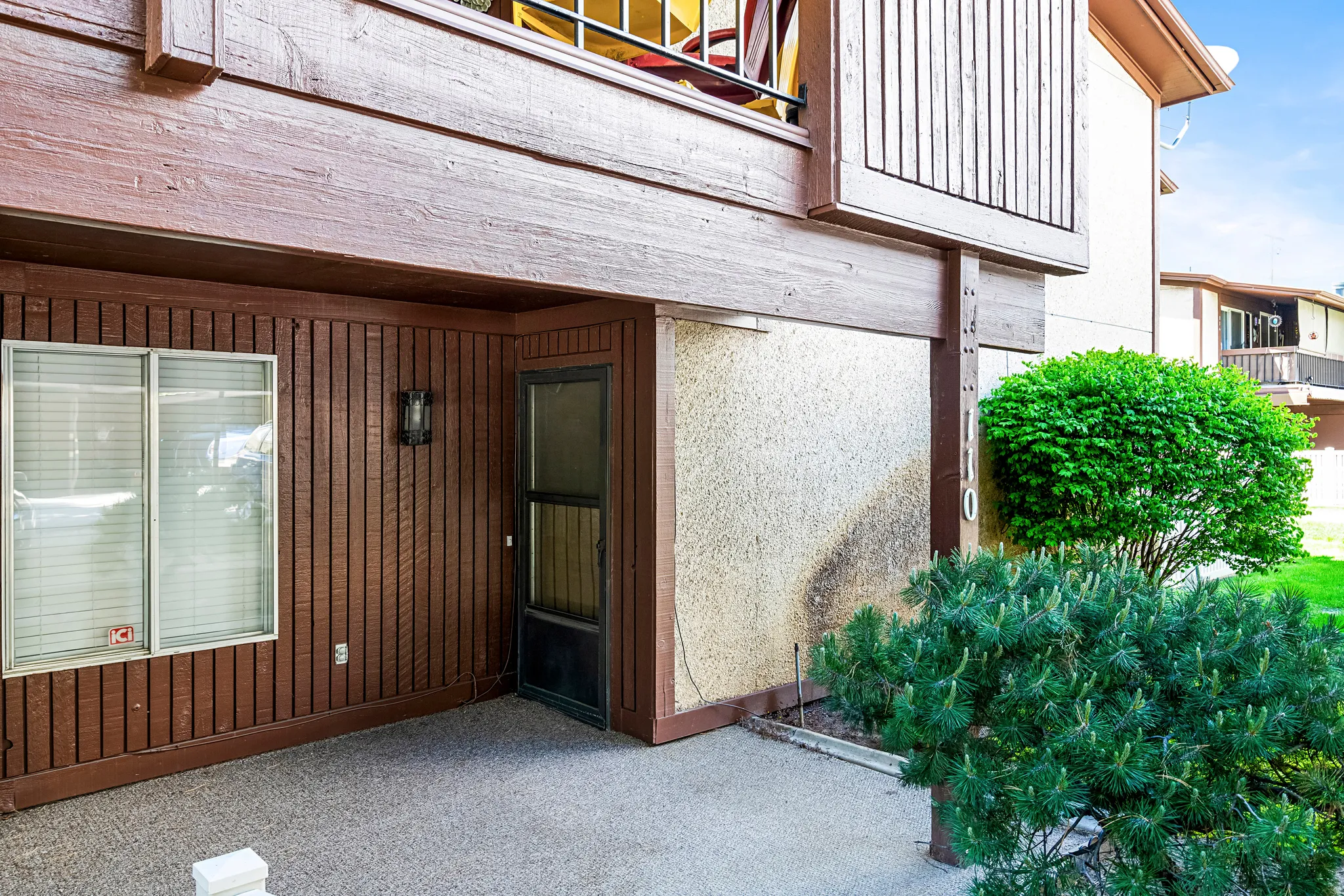 Ground-level patio with concrete flooring
