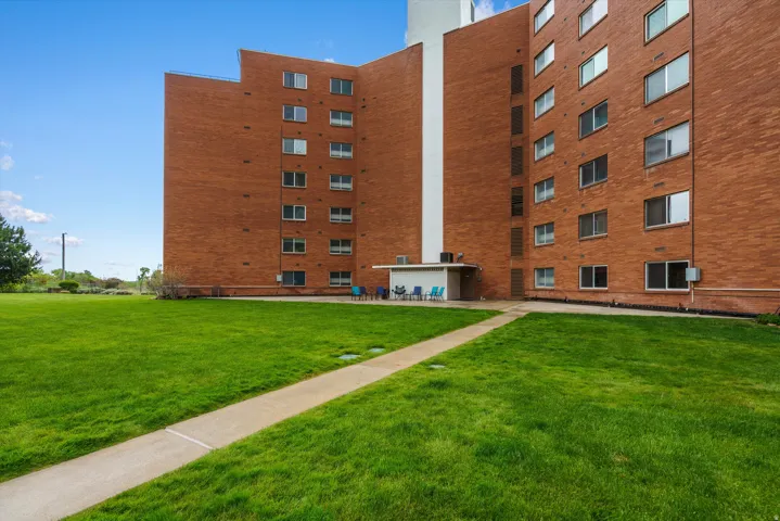 Multi-story brick building with multiple windows