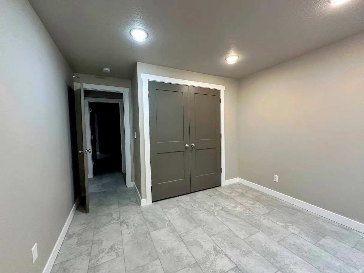 Neutral-toned interior room featuring light gray walls and white trim
