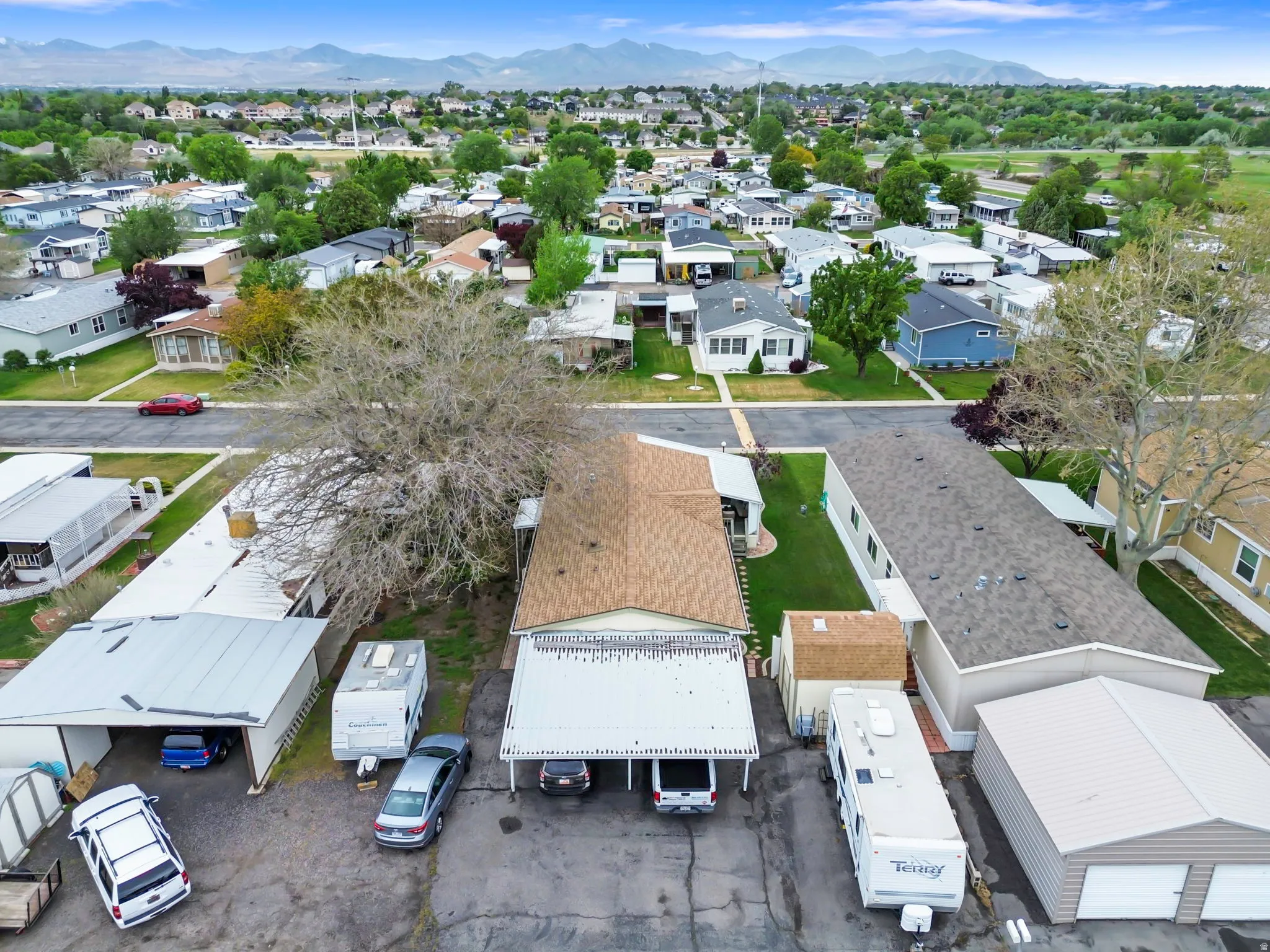 Aerial perspective showcasing a residential community with distant mountains