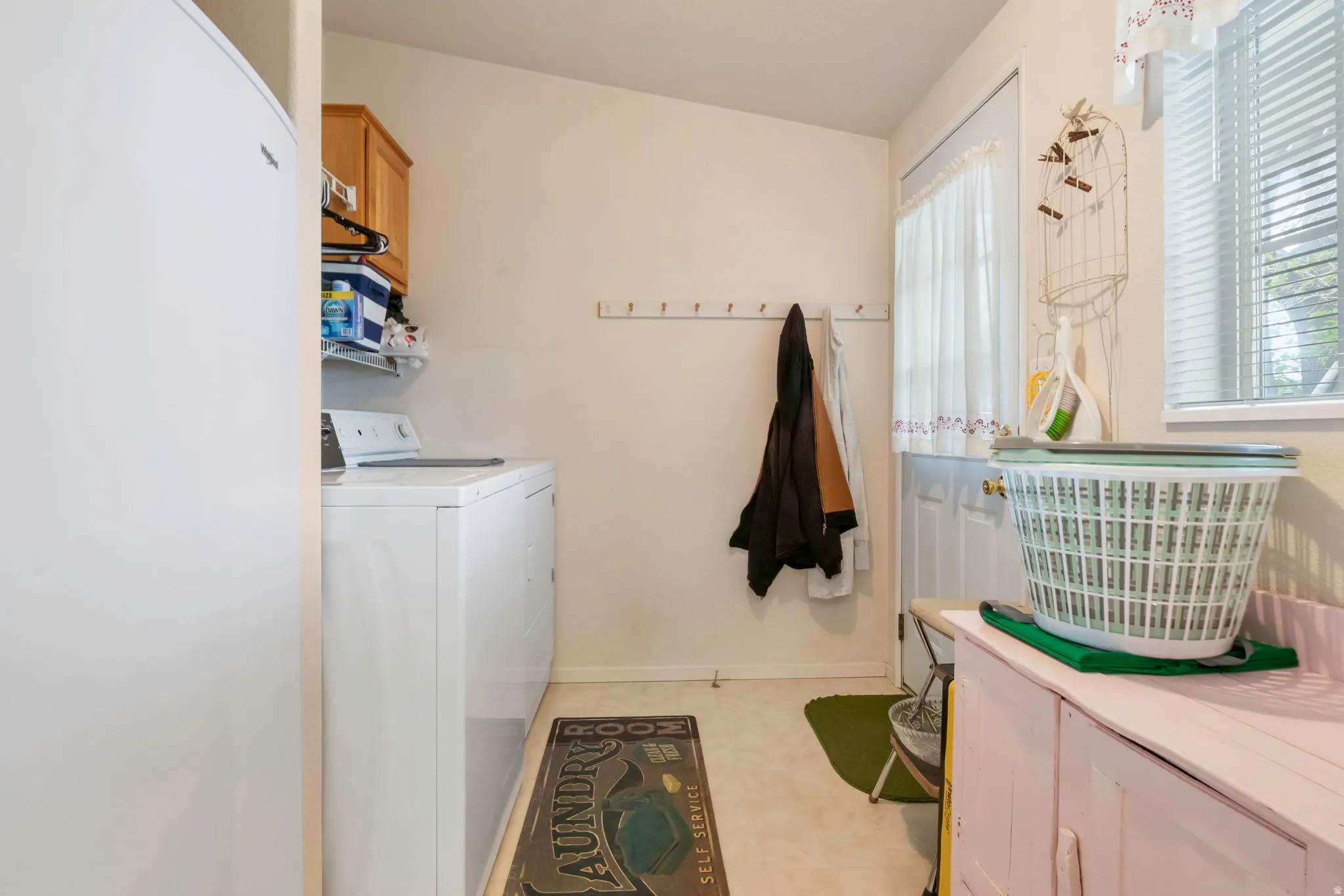 Dedicated utility space featuring a washing machine and dryer