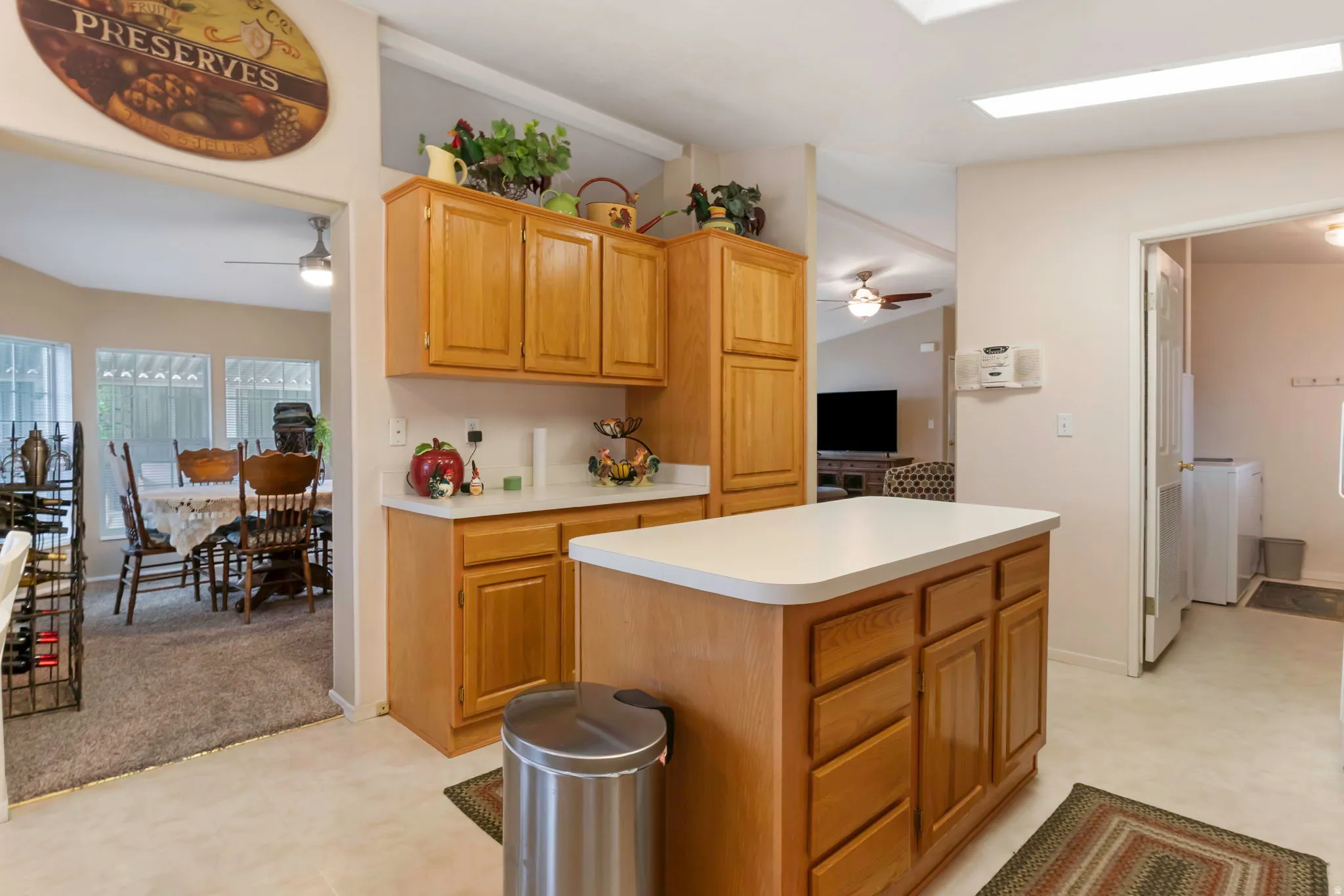 Kitchen featuring a central island with countertop, wood cabinetry, and recessed lighting